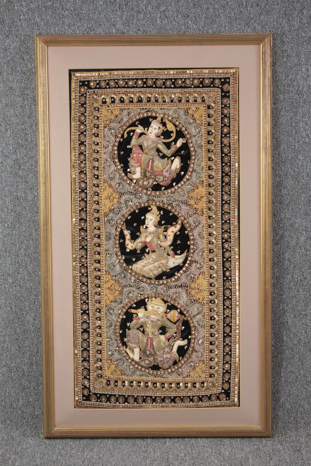 A Thai Buddha embroidery. A highly detailed work decorated with sequins. Framed and glazed. H.105