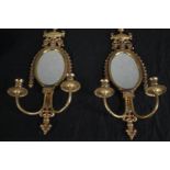 A pair of brass mirrored sconces with two branch candle holders. H.59cm. (each)