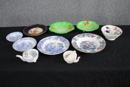 A collection of mixed porcelain plates and bowls, including a collection of cabbage ware plates.