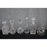 A collection of five 19th and early 20th century decanters and a wine jug. All decanters are
