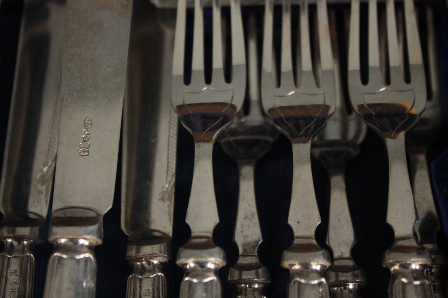 A complete Victorian mahogany canteen of silver plate cutlery for twelve people. The handles with - Image 5 of 6