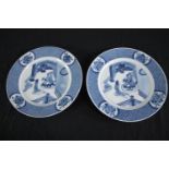 A pair of Qing dynasty Chinese blue and white china plates. Featuring a court scene withing a