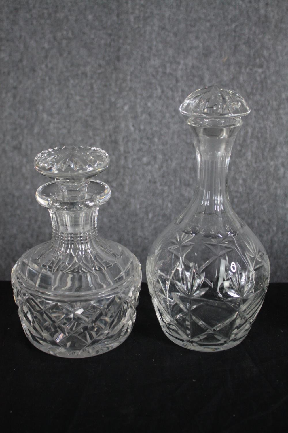 A mixed collection of four glass decanters and a jug. Cut glass and complete with their stoppers. - Image 3 of 4