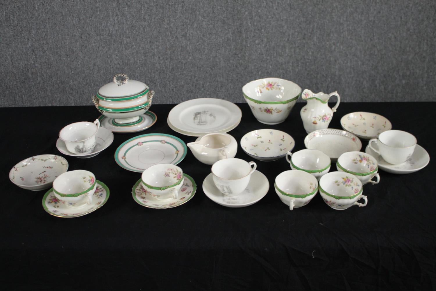 A collection of ceramics and porcelain, including a hand painted pale green and floral design