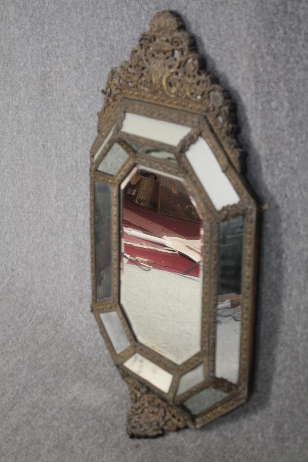 Wall mirror, C.1900 Dutch style in repousse metal cushion frame. H.109 W.62cm. - Image 3 of 5