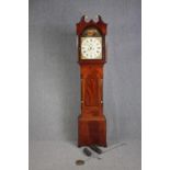 J M TUCKER, Trowbridge, a George IV inlaid figured mahogany eight day longcase clock with fluted