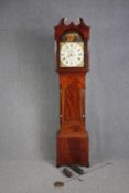 J M TUCKER, Trowbridge, a George IV inlaid figured mahogany eight day longcase clock with fluted