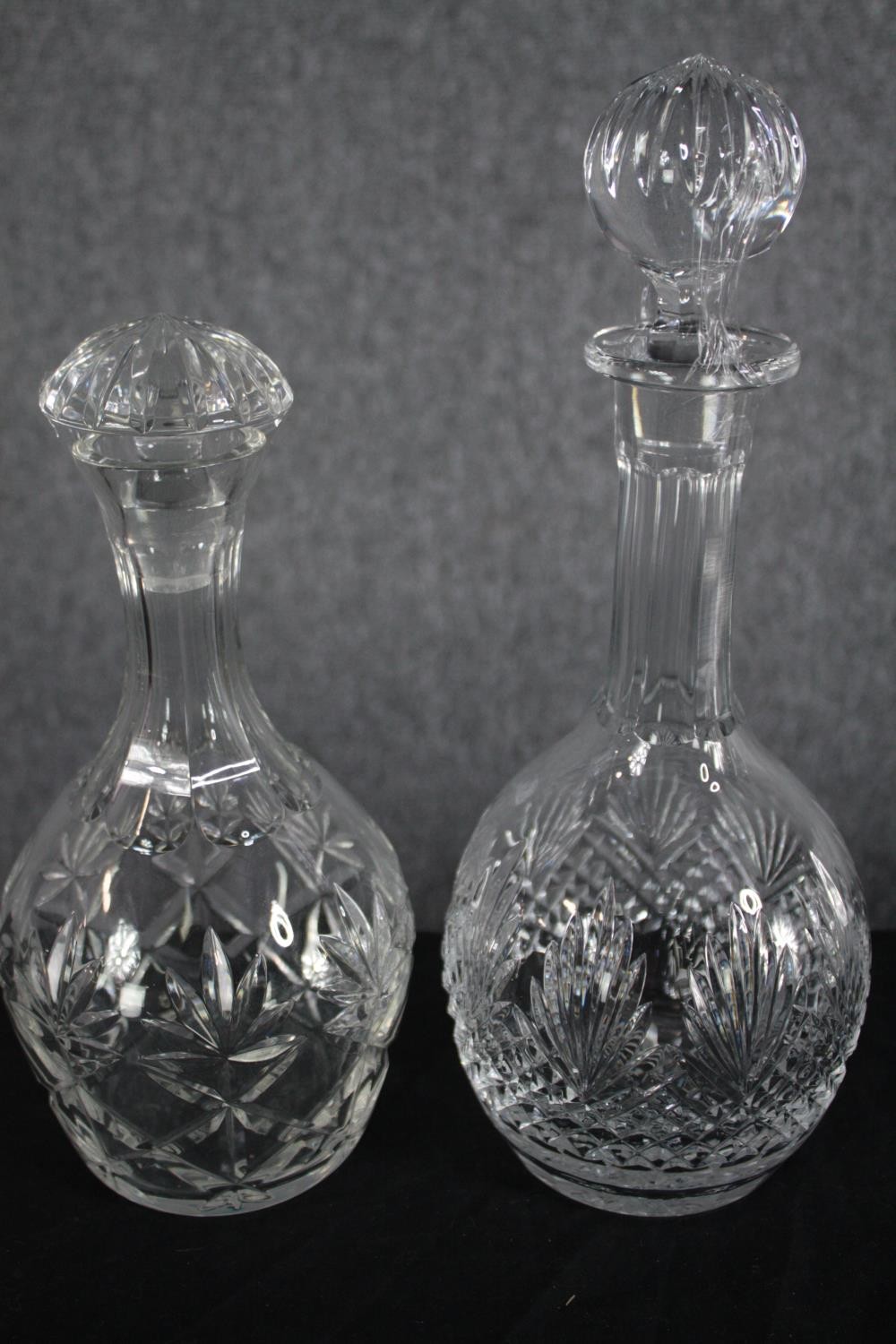 A mixed collection of four glass decanters and a jug. Cut glass and complete with their stoppers. - Image 2 of 4