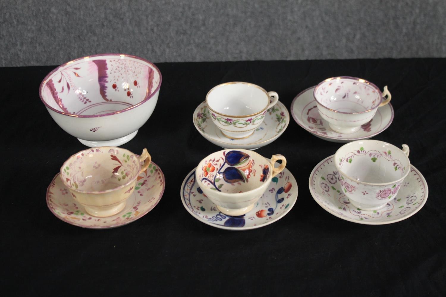A collection of 19th century lustre ware tea cups and saucers and a sugar bowl. Dia.17cm. (largest)