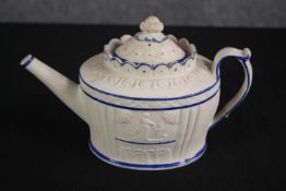 Castleford teapot. Circa 1810. Decorated with an arcade of classical scenes of figures. White and