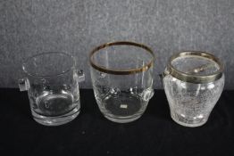 A miscellaneous collection of three glass ice buckets or wine coolers, one with a gilt rim. H.14