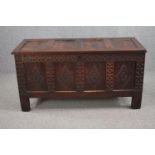 Coffer, late 17th century or early 18th century lozenge carved oak panels on stile supports. H.69