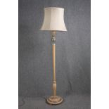 A standard floor lamp with a decorative stem. H.183cm.