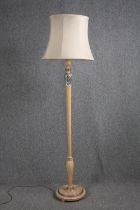 A standard floor lamp with a decorative stem. H.183cm.