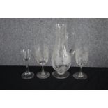 Two etched Victorian wine glasses with etched foliate and fruit design with a matching wine jug