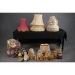 A large assortment of lamp shades, some silk with tassel edging. Dia.59cm. (largest)