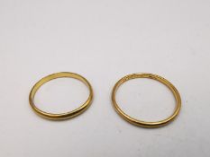 Two 22 carat yellow gold D-shape wedding bands. Hallmarked:London, 1960 and 1927. Ring size Q and M.