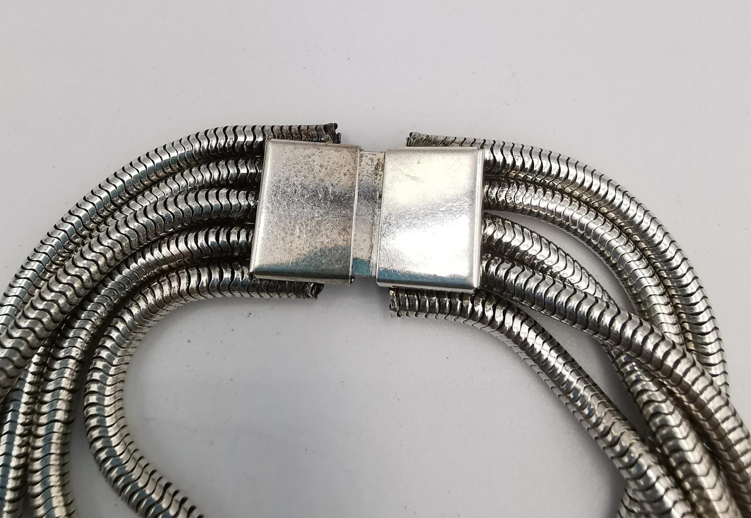 A collection of silver and white metal necklaces and chains, including a white metal snake chain and - Image 5 of 13