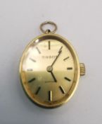 A Tissot 18ct yellow gold automatic ladies pendant watch with hanging loop. Oval face with gilt