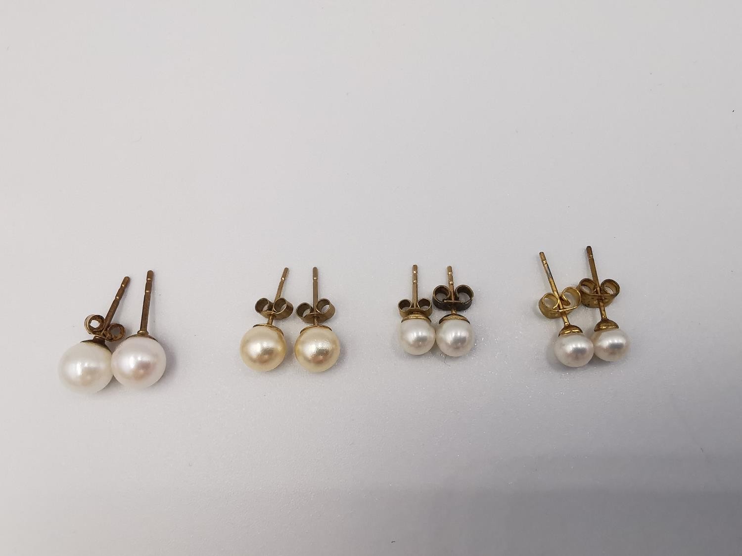 Four pairs of round cultured pearl stud earrings, three pairs with 9ct posts and butterflies. One - Image 7 of 7