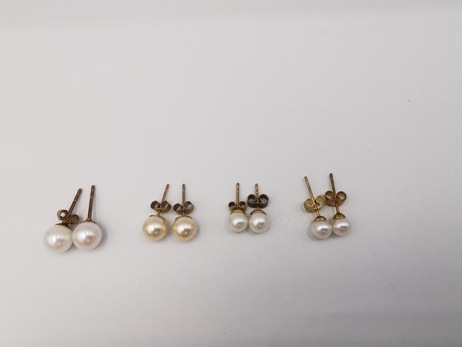 Four pairs of round cultured pearl stud earrings, three pairs with 9ct posts and butterflies. One - Image 6 of 7