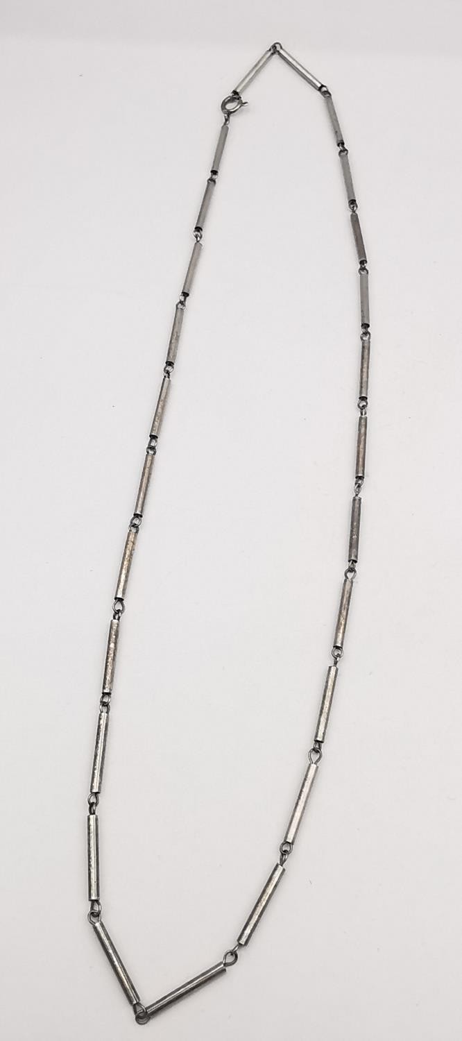 A collection of silver and white metal necklaces and chains, including a white metal snake chain and - Image 9 of 13