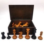 A 19th century weighted boxwood and ebony Staunton chess set in an oak 19th century box with