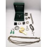 A collection of jewellery, including a Whitby carved jet and silver flower necklace, a silver and
