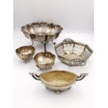 A collection of silver salts and bon bon dishes, including a pair of repousse rose design salts by