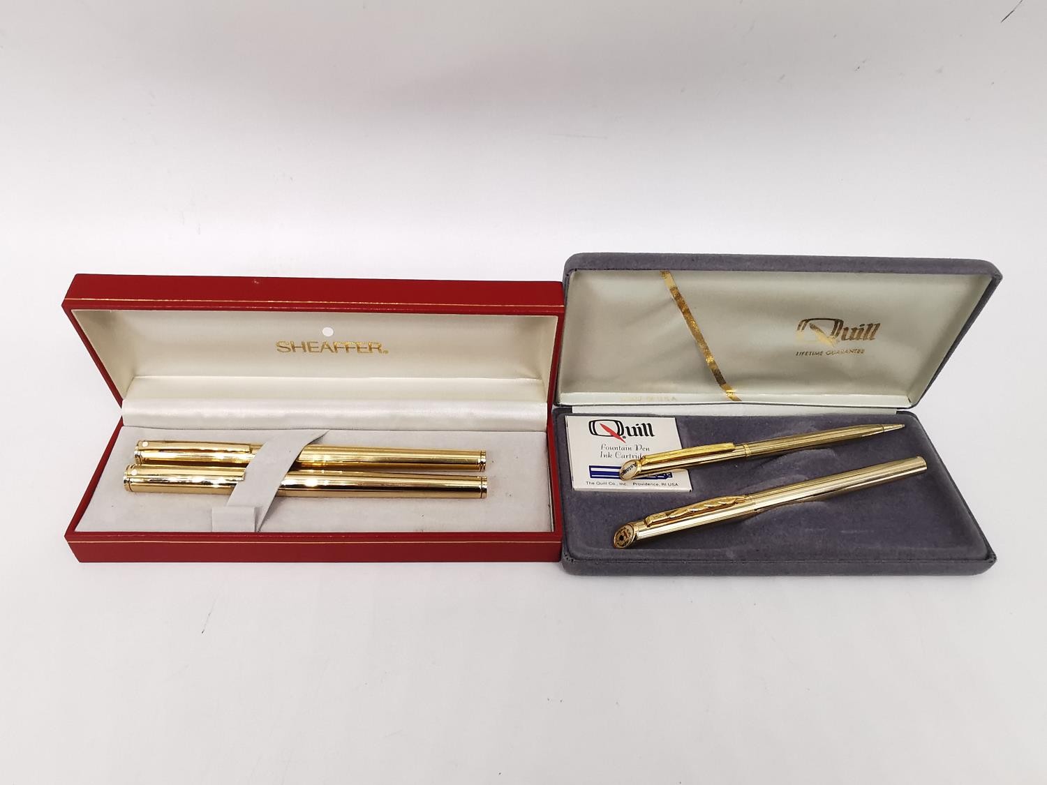 Two cased sets of vintage fountain pens, including a gold plated Schaeffer set with gold plated nibs