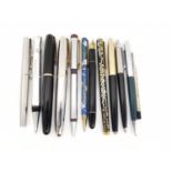 A collection of eleven vintage ballpoint and fountain pens, including two Japanese Tombow