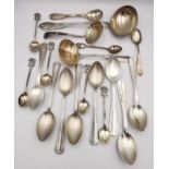 A collection of Sterling and Continental silver and white metal cutlery, including a shell sugar