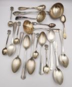 A collection of Sterling and Continental silver and white metal cutlery, including a shell sugar