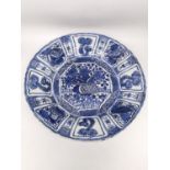 A very large Kangxi period Chinese Kraak blue and white charger decorated to its center with a