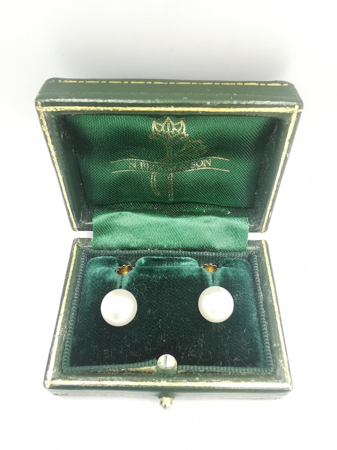 A green leather cased pair of early 20th century white cultured pearl 9ct gold screw back