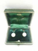 A green leather cased pair of early 20th century white cultured pearl 9ct gold screw back
