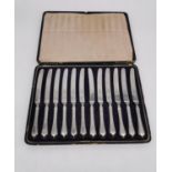 A leather cased set of twelve silver handled butter knives by George Ibbetson & Co. L.30 W.21.5cm