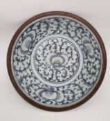 A 19th century Batavia Chinese ceramic basin with hand painted stylised lotus flowers and