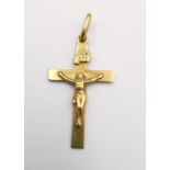 A vintage Italian Unoaerre 18ct yellow gold crucifix pendant with relief figure of Jesus and sign