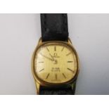 A ladies gold plated Omega de Ville quartz watch with black leather strap and steel back. The dial