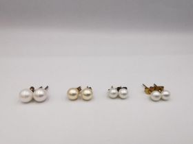 Four pairs of round cultured pearl stud earrings, three pairs with 9ct posts and butterflies. One