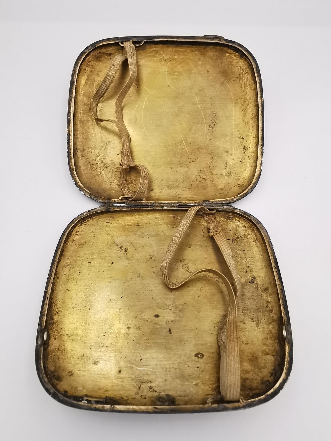 An early 20th century Arabic white metal (tests as silver) niello work rounded cigarette case. One - Image 3 of 3