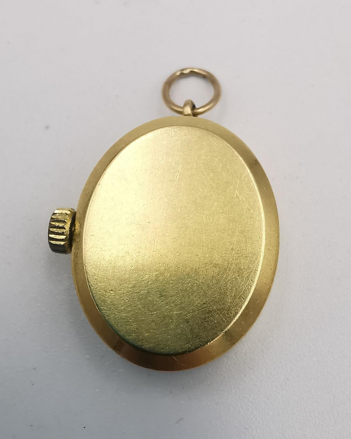 A Tissot 18ct yellow gold automatic ladies pendant watch with hanging loop. Oval face with gilt - Image 3 of 3