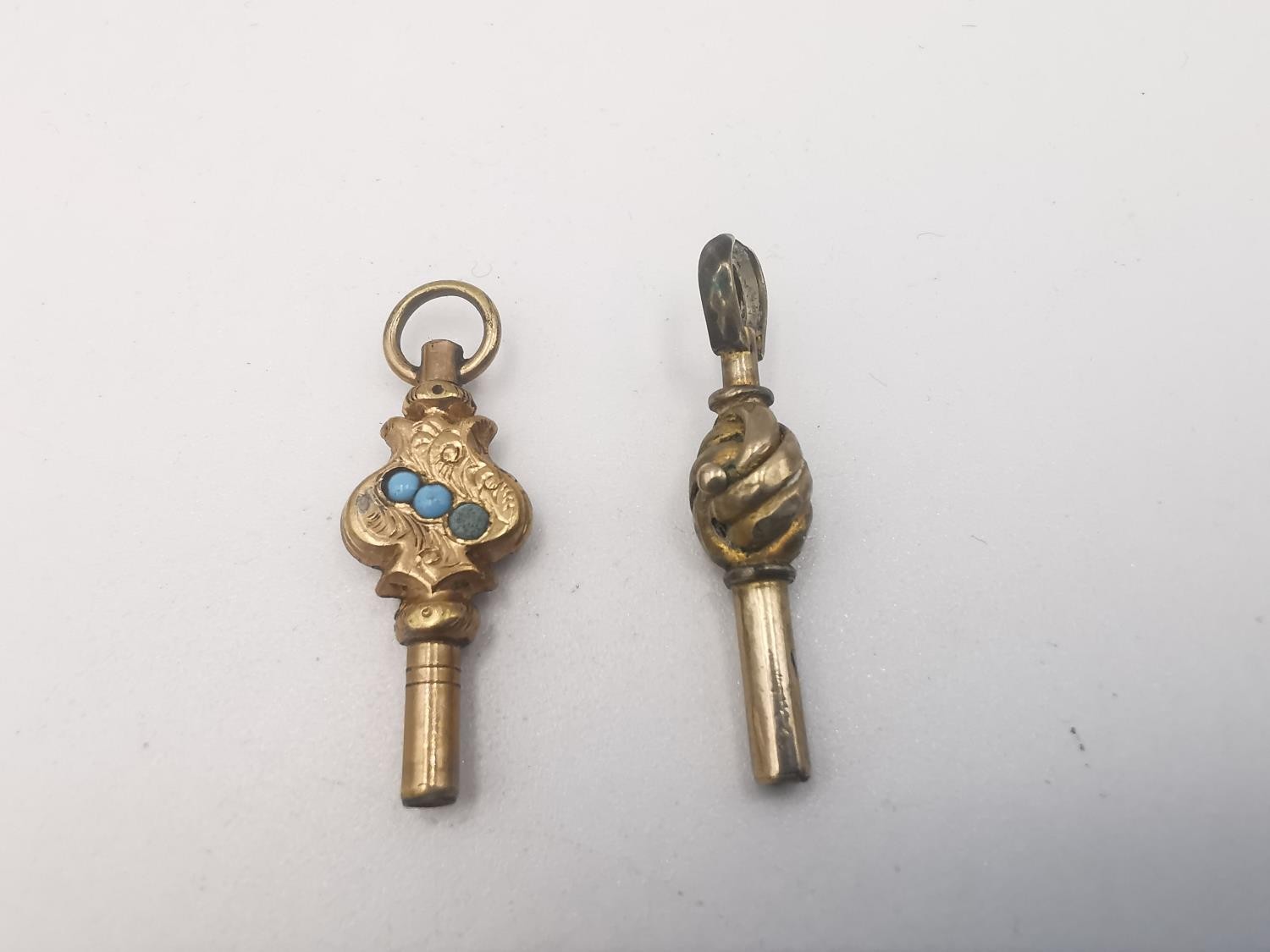 A collection of early 20th century rolled gold fobs, pocket watch keys and a miniature sliding - Image 6 of 8