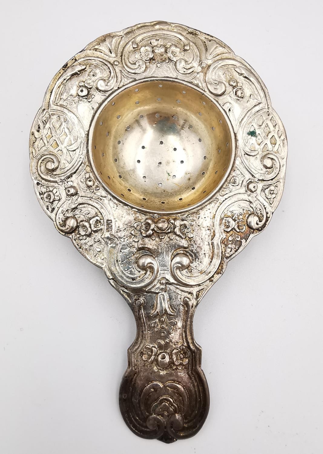 A collection of silver and white metal items, including a pair of sugar tongs with engraved - Image 12 of 16