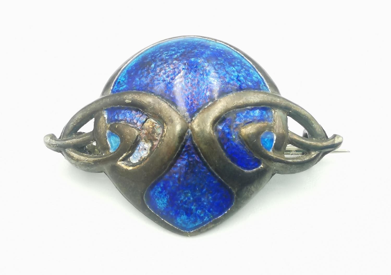 An Art Nouveau blue enamel and silver Charles Horner brooch. Secure pin to the back. Hallmarked: