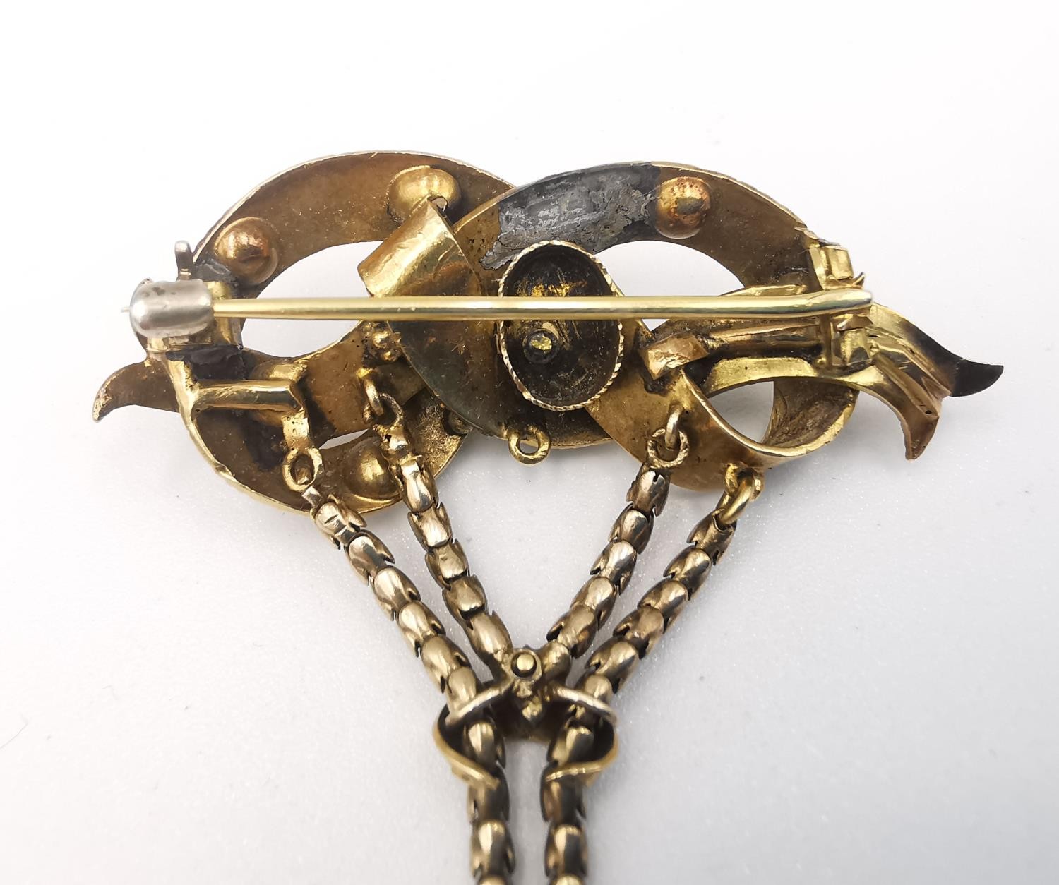 A 19th century yellow metal (tests as higher than 9ct) articulated brooch set with natural seed - Image 6 of 6