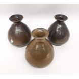 Three 20th century Japanese brown glaze bottle vases with raised character mark to the base. H.15cm