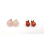 Two pairs of 15 carat yellow gold gemstone stud ball earrings, one pair orange coral and the other