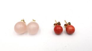 Two pairs of 15 carat yellow gold gemstone stud ball earrings, one pair orange coral and the other